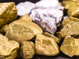 nuggets of gold and silver piled up, precious stones used in the industry and jewelry. Concept of elux and wealth.