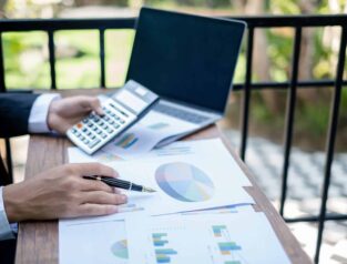 Young businessman financial market analyst sits at their desks a